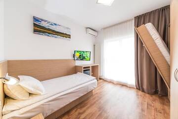 Фото номера Двухместный номер с 2 отдельными кроватями - Подходит для гостей с ограниченными физическими возможностями Апарт-отели Residence Il Lago г. Клуж-Напока 4