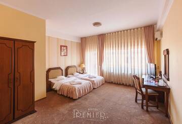Фото номера Стандартный двухместный номер с 2 отдельными кроватями Отель Hotel Premier г. Клуж-Напока 2